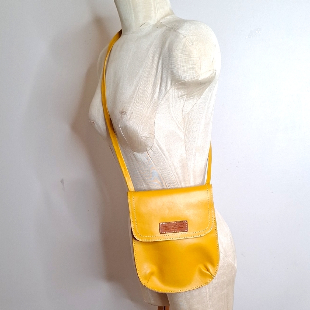 Vibrant Yellow Crossbody Bag with Flap Closure and Smooth Material